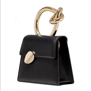 Designer hand bag with no name.  Black, white